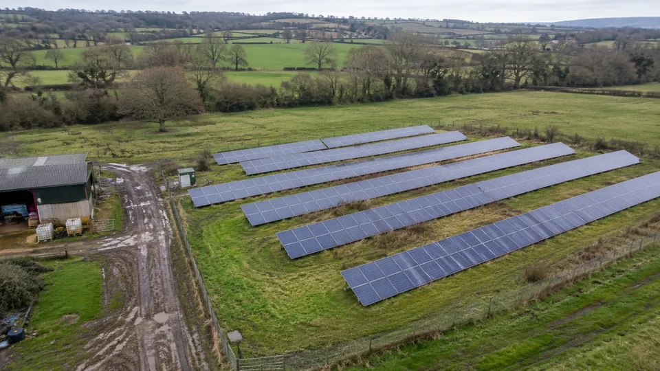 Solar panels and maintenance tracks on a rural site